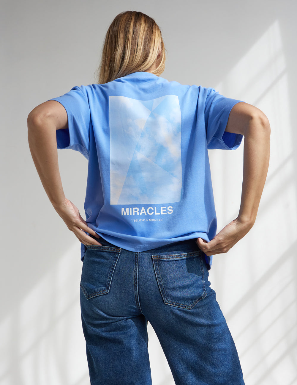 Elevated Faith Christian Apparel T-Shirt in Light Blue with 'Miracles' Graphic on the Back