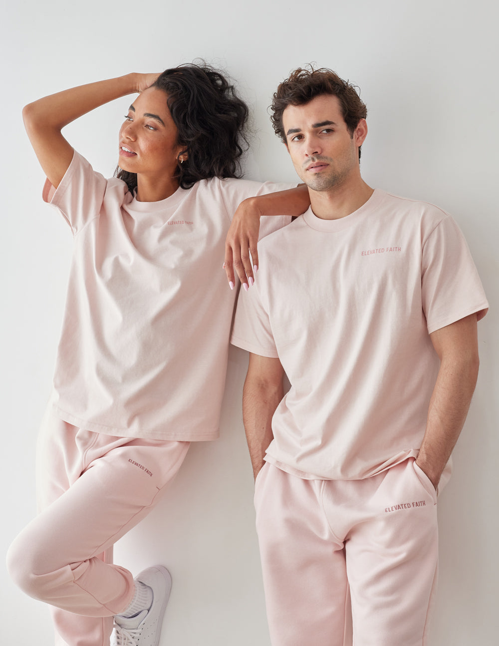 Elevated Faith Christian Apparel T-Shirt in soft pink worn by two models for a trendy look