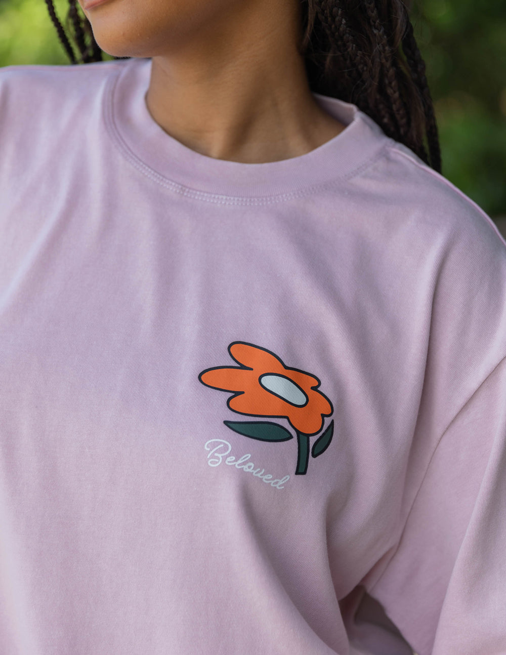 Elevated Faith Christian Apparel T-Shirt in soft pink with a colorful flower design and 'Beloved' text