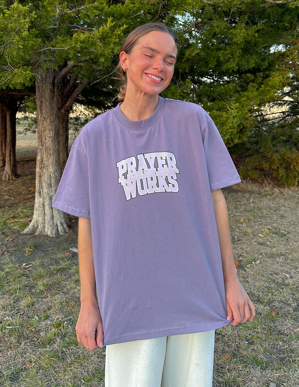 Elevated Faith Christian Apparel T-Shirt in purple featuring 'Prayer Works' graphic design