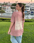 Elevated Faith Christian Apparel T-Shirt in pink featuring a scenic back design with the word strength