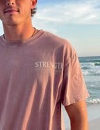 Elevated Faith Christian Apparel T-Shirt with 'Strength' graphic for inspirational wear at the beach
