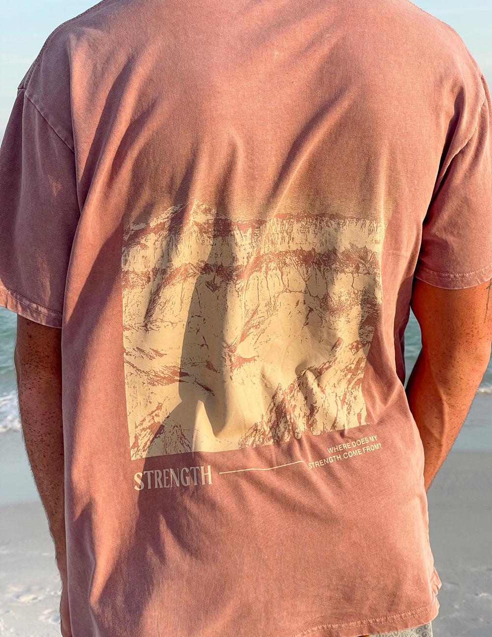 Elevated Faith Christian Apparel T-Shirt featuring a strength graphic on the back for casual wear