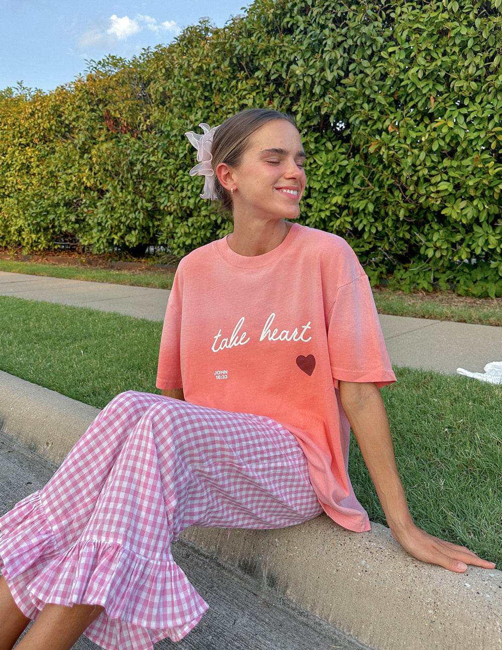 Elevated Faith Christian Apparel T-Shirt in pink with 'take heart' design, perfect for casual wear