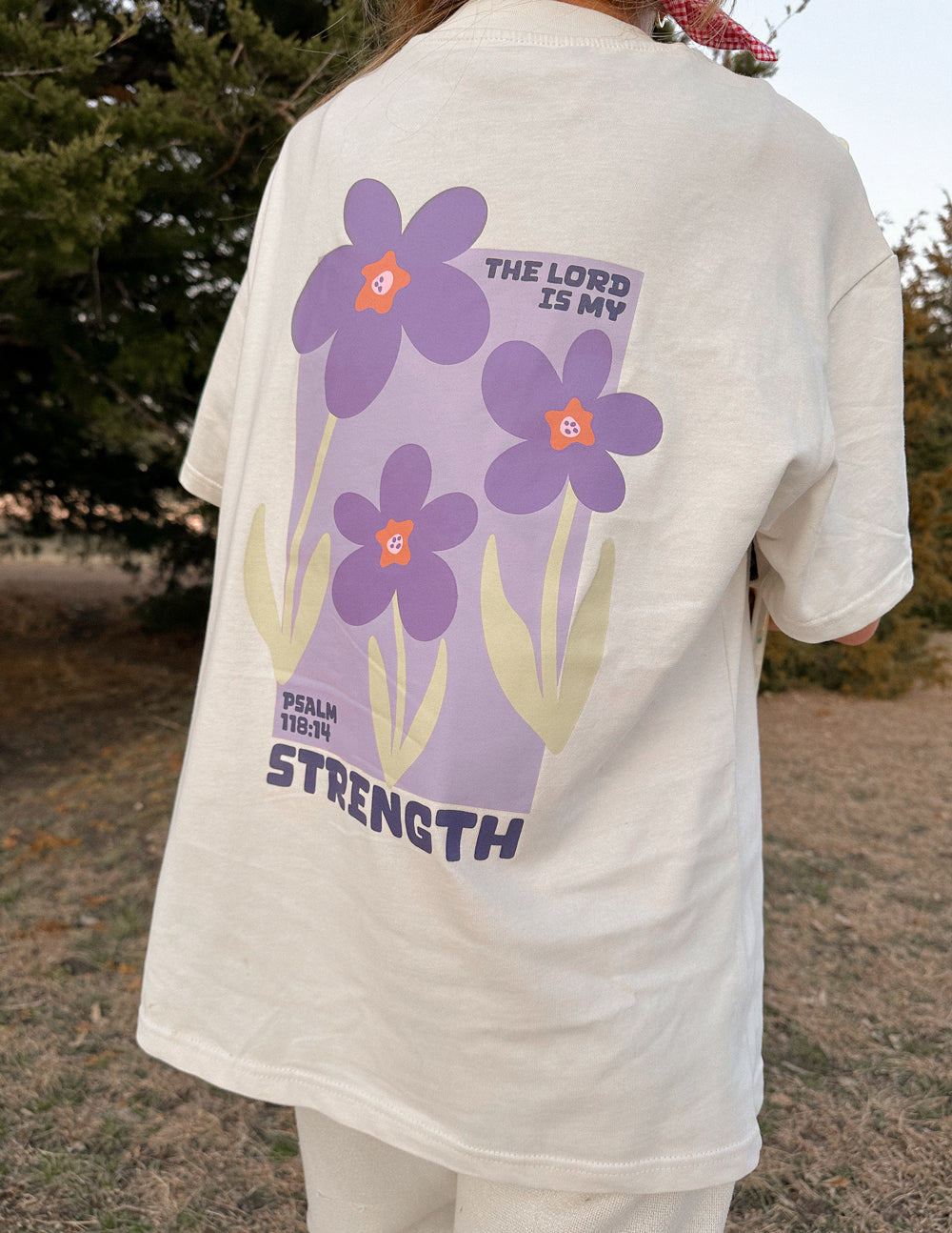 Elevated Faith Christian Apparel T-Shirt featuring a colorful floral design and inspirational message from Psalm 118:14