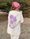 Elevated Faith Christian Apparel T-Shirt featuring floral design and inspirational text on back