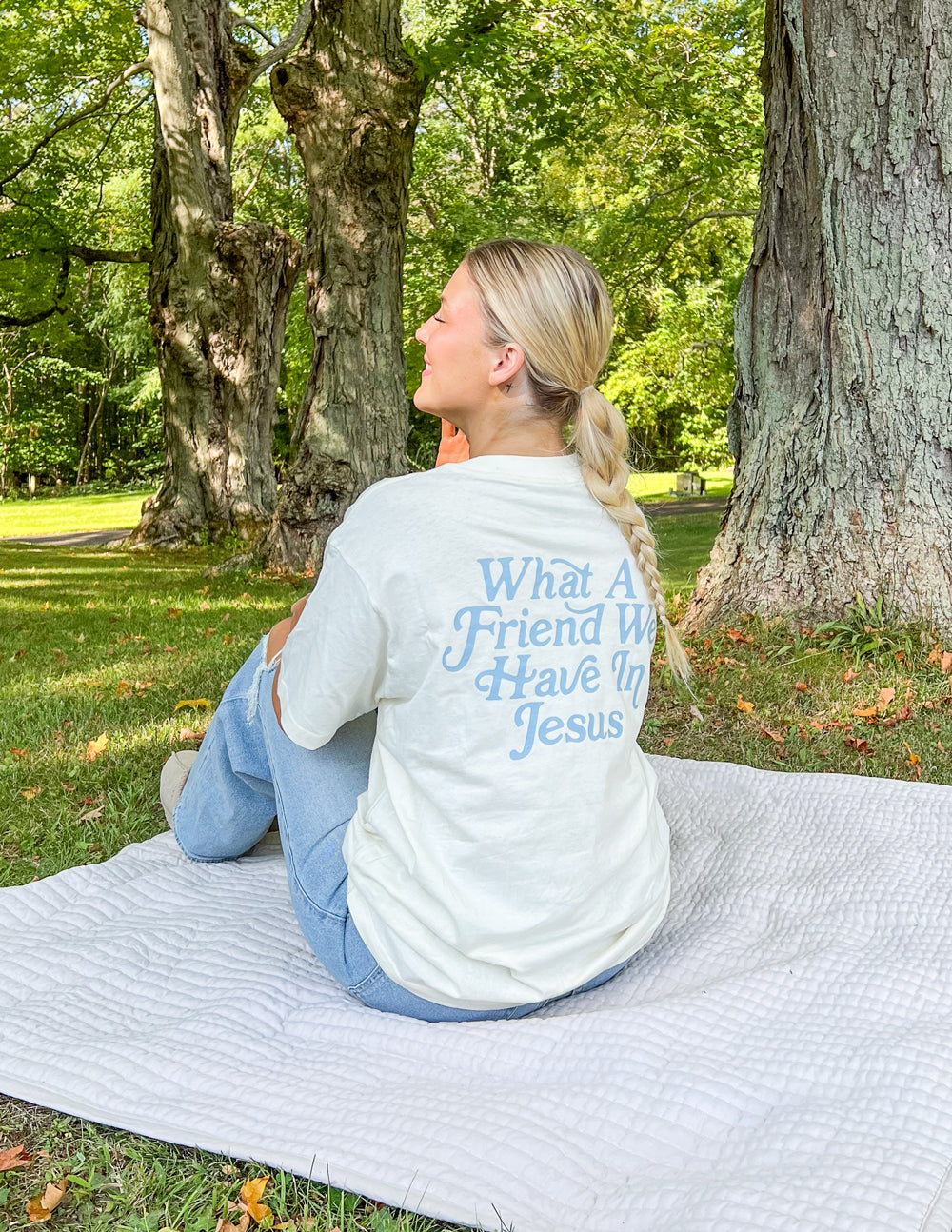Elevated Faith Christian Apparel T-Shirt with a meaningful message on the back in a natural outdoor setting