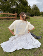 Elevated Faith Christian Apparel T-Shirt with inspirational design in a serene outdoor setting