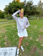 Elevated Faith Christian Apparel T-Shirt in light gray worn by a smiling model outdoors