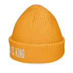 Bright orange Christian Beanie with text design stating 'Jesus is King' for stylish winter wear