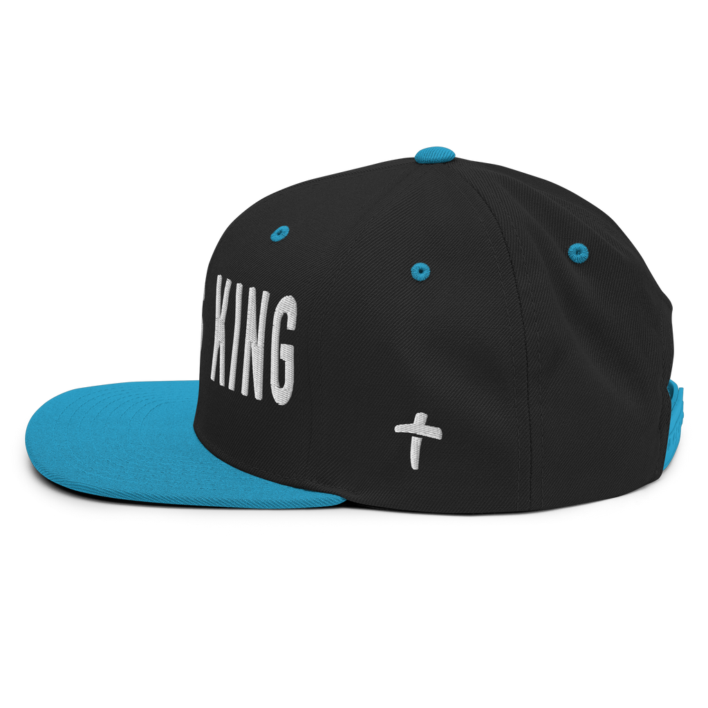 Christian Embroidered Hat in black and turquoise with the word King and a cross design