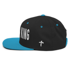 Christian Embroidered Hat in black and turquoise with the word King and a cross design