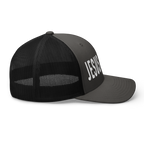 Side view of a black Christian Hat with JESUS printed in bold white letters