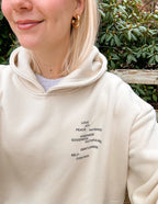 Elevated Faith Christian Hoodie in cream with inspirational words embroidered on the front