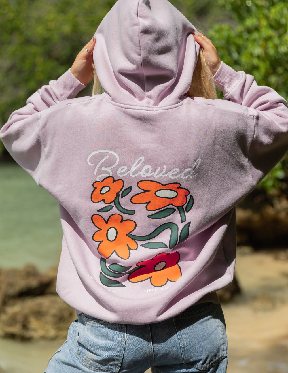 Elevated Faith Christian Hoodie in light pink with floral design and 'Beloved' text on the back