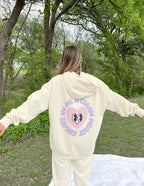 Elevated Faith Christian Hoodie in cream with playful heart graphic on back