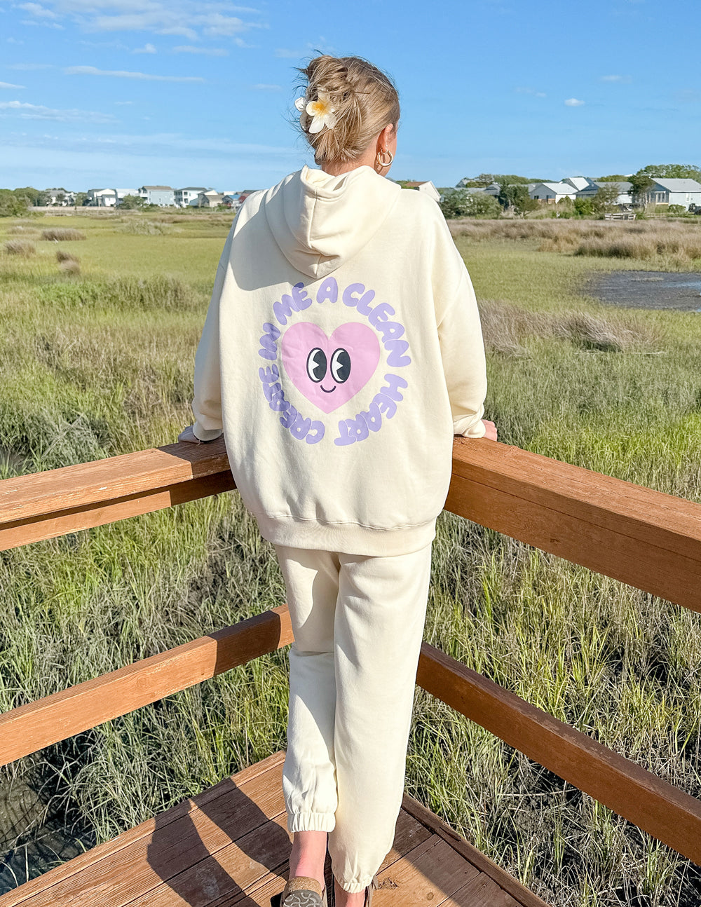 Elevated Faith Christian Hoodie in cream with a heart design on the back for a stylish look