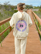 Cream Elevated Faith Christian Hoodie featuring a playful heart design on the back