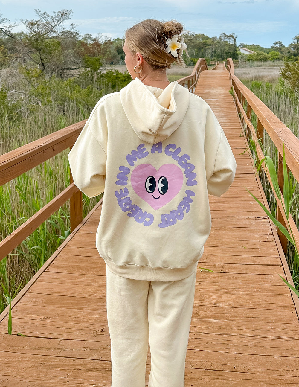Cream Elevated Faith Christian Hoodie featuring a playful heart design on the back
