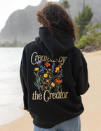 Elevated Faith Christian Hoodie with floral design and 'Created by the Creator' text on the back