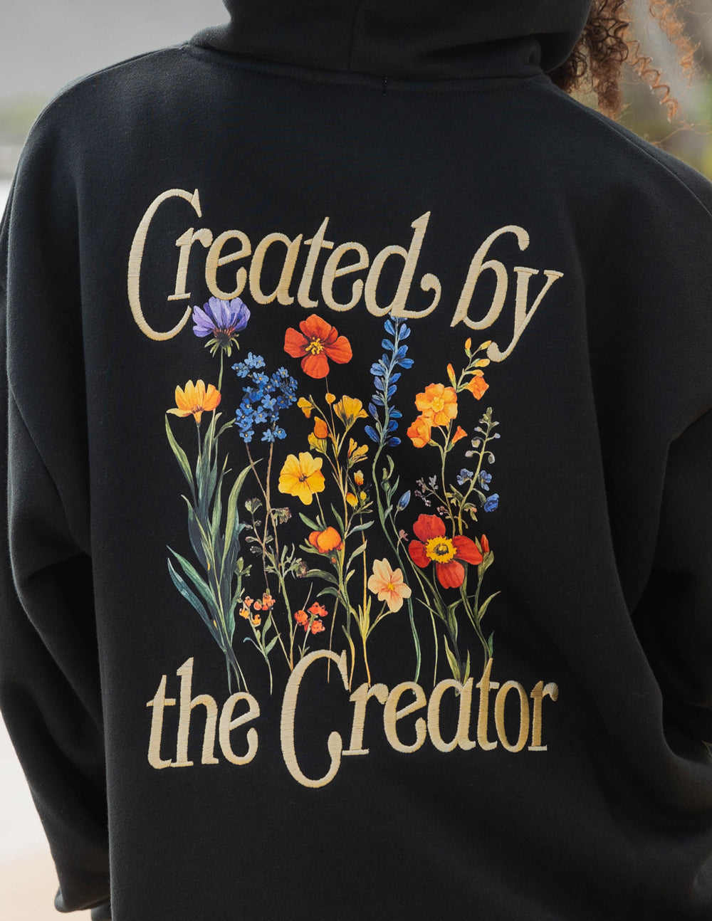 Elevated Faith Christian Hoodie featuring floral design and the text Created by the Creator