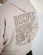 Elevated Faith Christian Hoodie in beige with a large 'DISCIPLES' graphic on the back