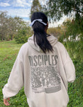 Elevated Faith Christian Hoodie in beige with large 'DISCPLES' graphic on the back