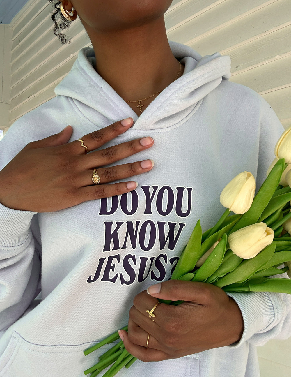 Elevated Faith Christian Hoodie in light gray with 'Do You Know Jesus?' print, styled with fresh tulips