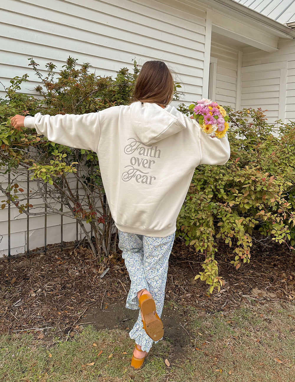 Cream Elevated Faith Christian Hoodie with 'Faith over Fear' print, perfect for casual wear and expressing faith