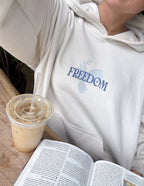 Elevated Faith Christian Hoodie in Cream with 'Freedom' Graphic, Ideal for Casual Wear