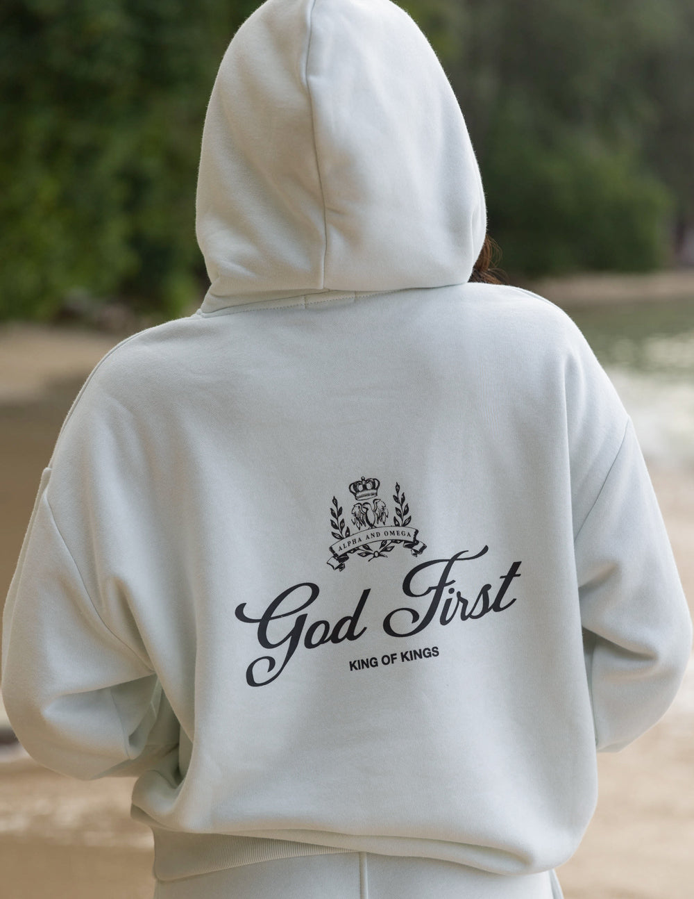 Light gray Christian Hoodie from Elevated Faith featuring God First design on the back