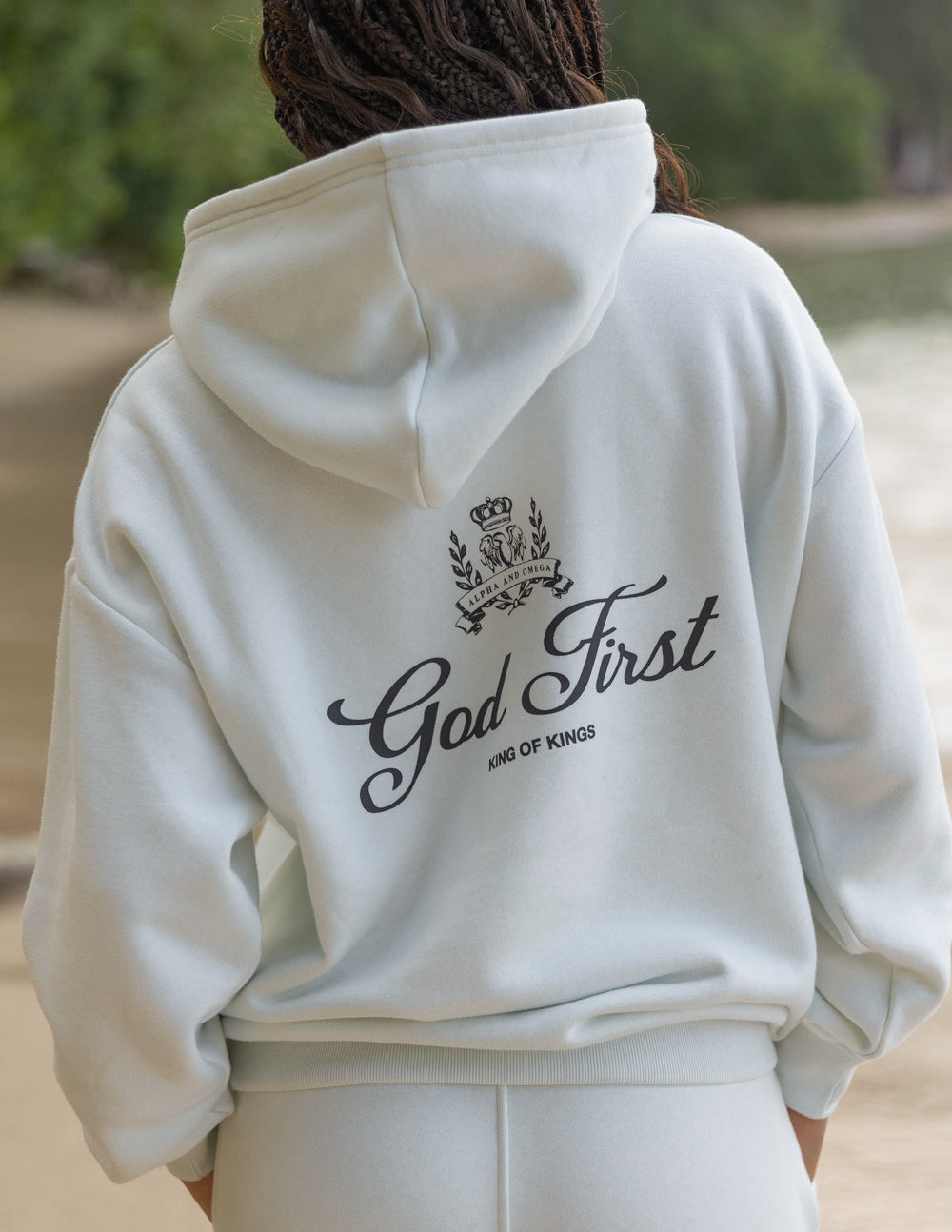 Elevated Faith Christian Hoodie in light blue featuring 'God First' design on the back