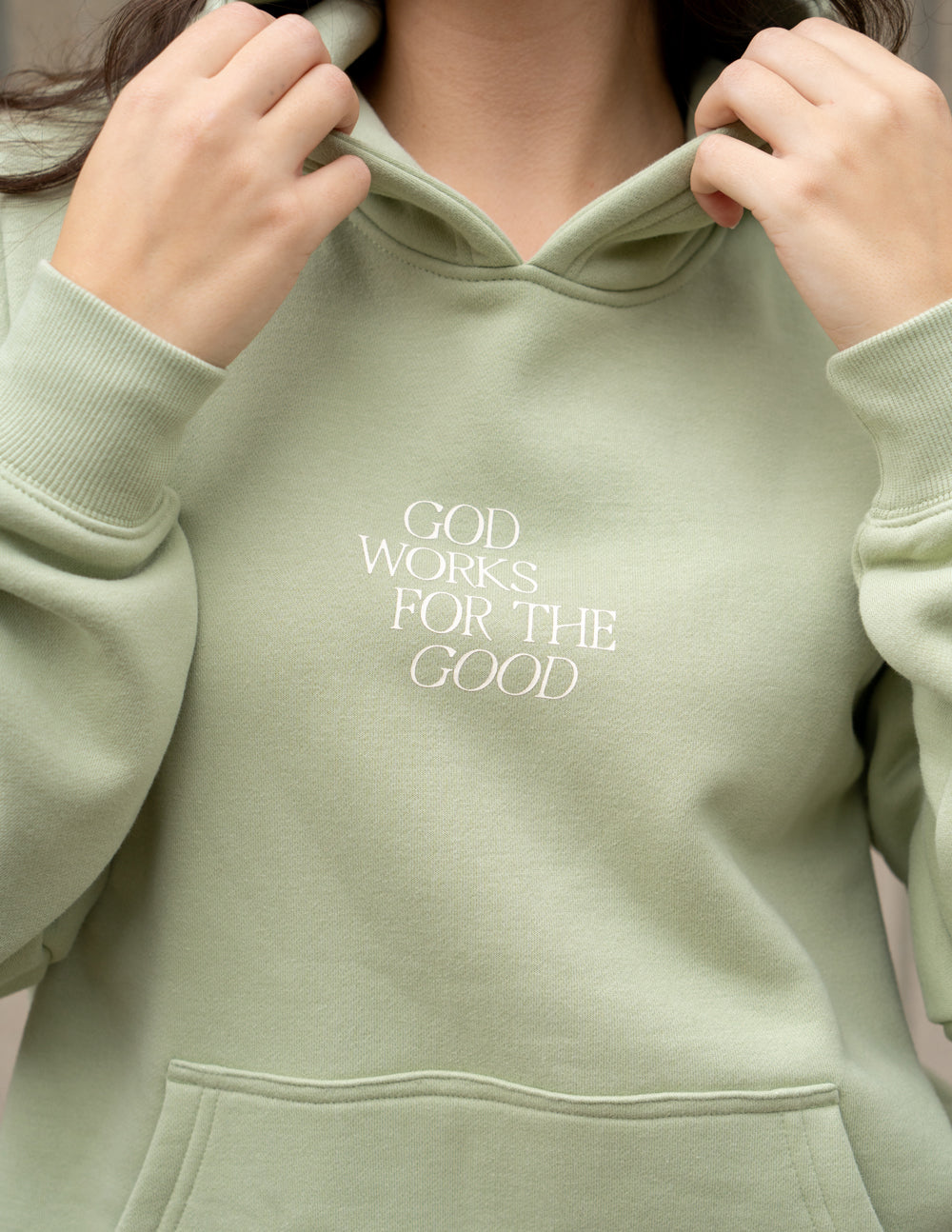 Elevated Faith Christian Hoodie in pastel green with embroidered 'God Works for the Good' message