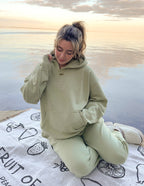 Elevated Faith Christian Hoodie in light green, perfect for casual wear and comfort by the water