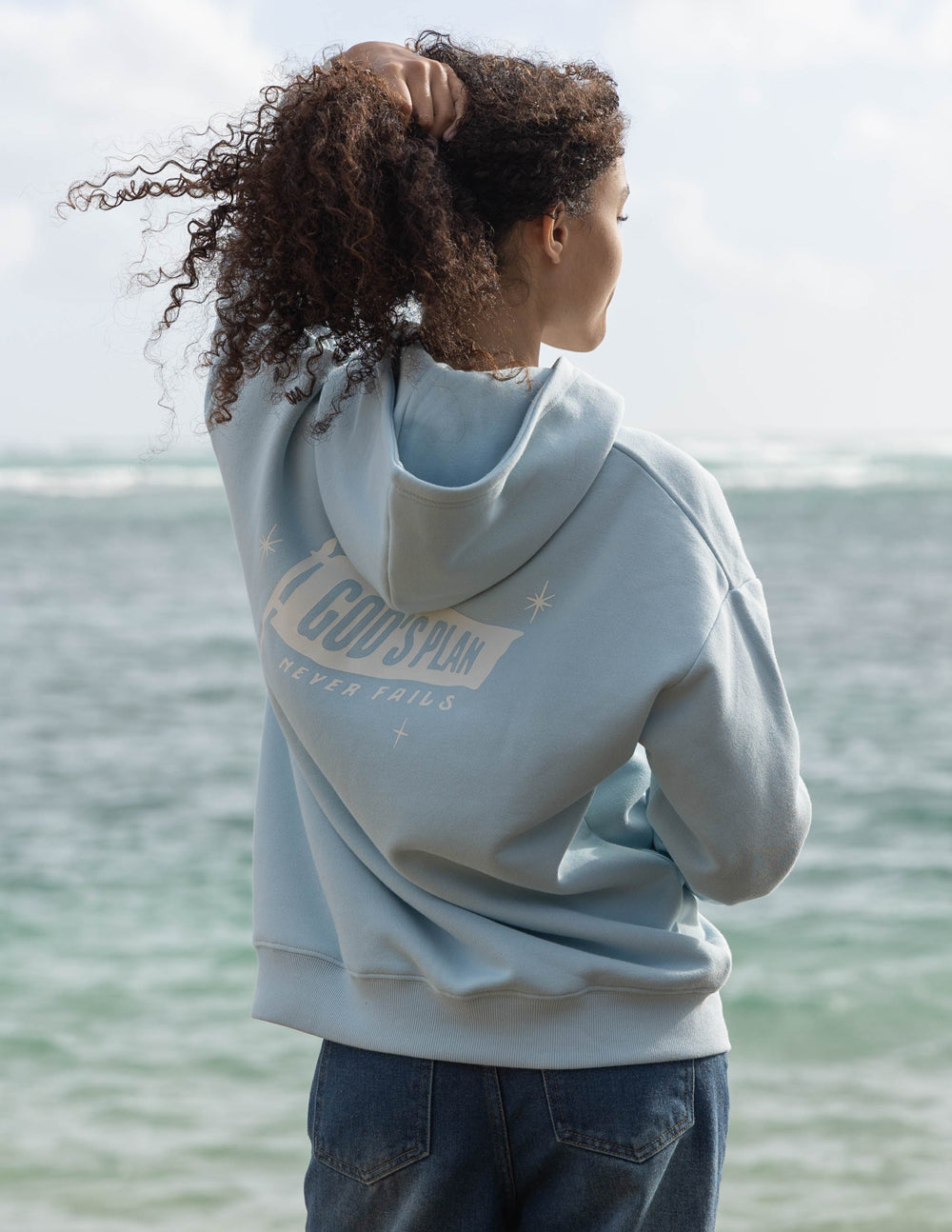 Elevated Faith Christian Hoodie in light blue with stylish back design showcasing faith-inspired message