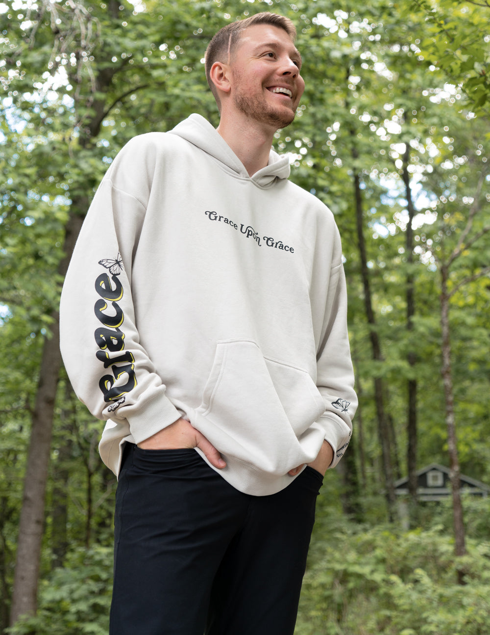 Elevated Faith Christian Hoodie in light beige featuring 'Grace Upon Grace' text design
