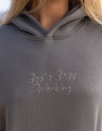 Elevated Faith Christian Hoodie in Gray with 'God's Still Working' Embroidery on the Front