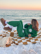 Green Elevated Faith Christian Hoodie featuring stylish design, perfect for casual beach outings