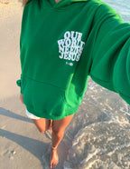 Green Christian Hoodie from Elevated Faith with 'Our World Needs Jesus' graphic print on front