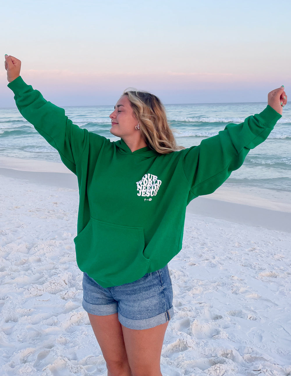 Green Christian Hoodie from Elevated Faith featuring a positive message, perfect for casual beach outings