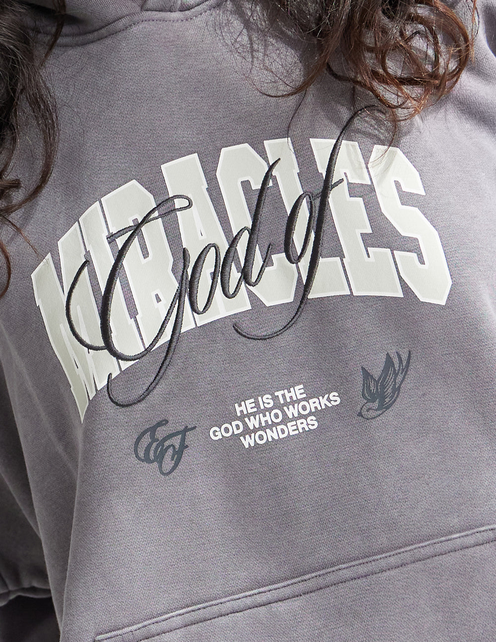 Elevated Faith Christian Hoodie featuring God of Miracles graphic for stylish faithwear