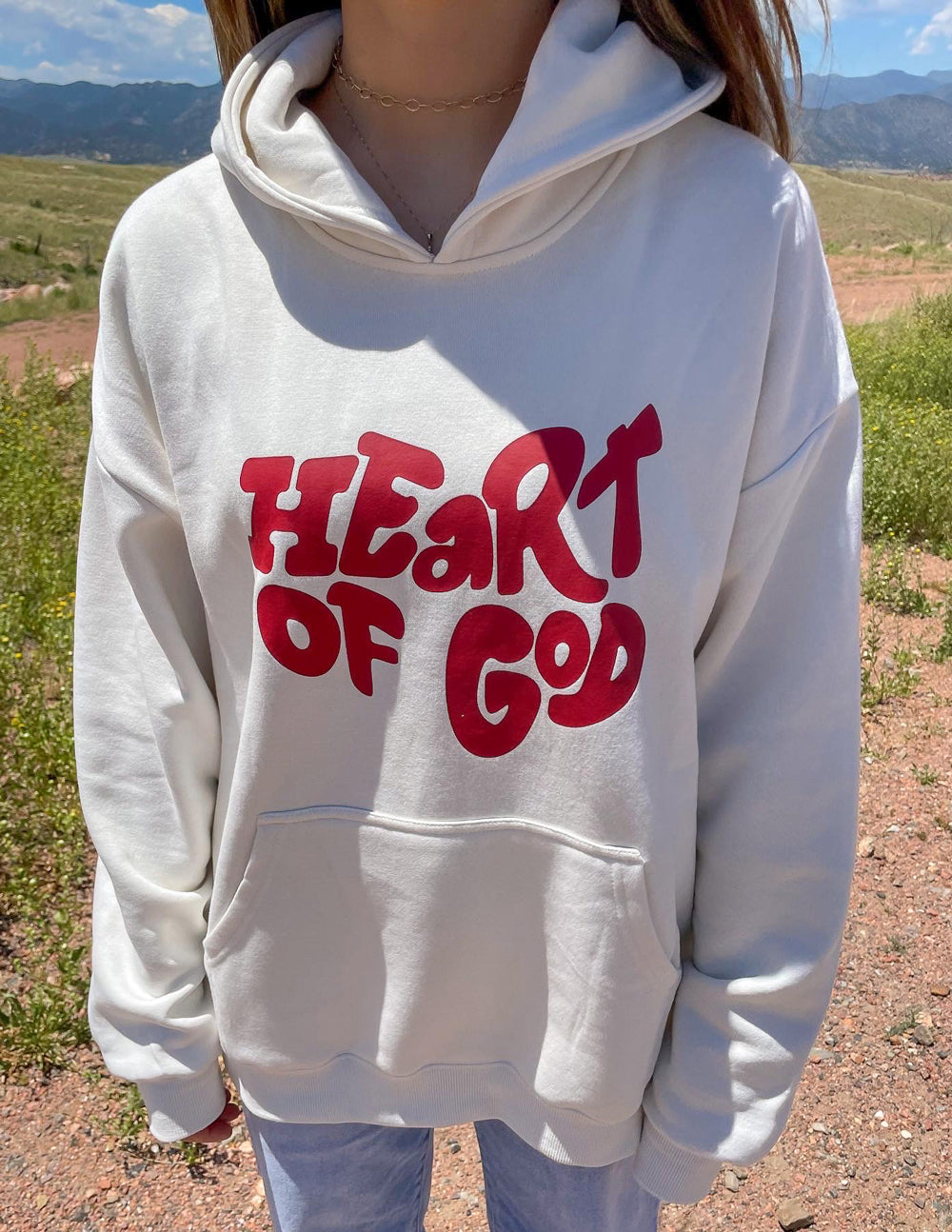 Elevated Faith Christian Hoodie featuring 'Heart of God' graphic in vibrant red on soft fabric
