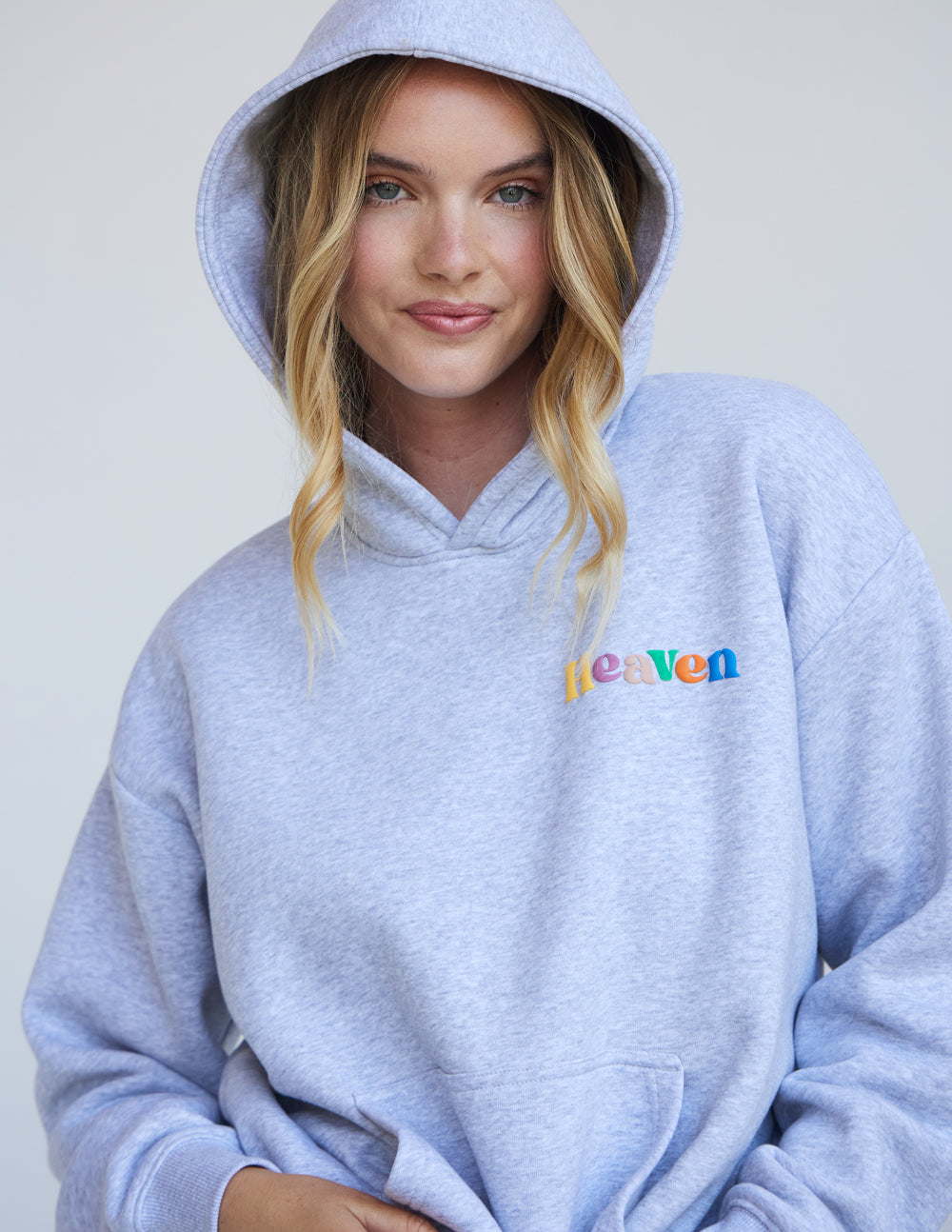 Elevated Faith Christian Hoodie in light gray featuring colorful 'Heaven' text for a stylish faith statement
