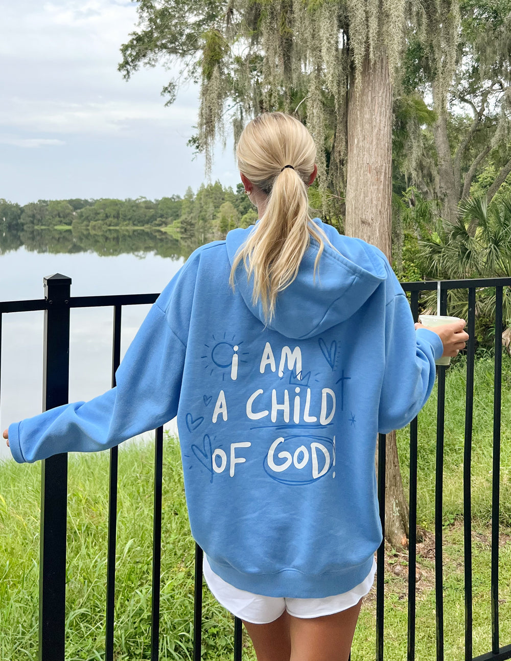 Light blue Christian Hoodie with 'I am a Child of God' design on the back, perfect for casual wear