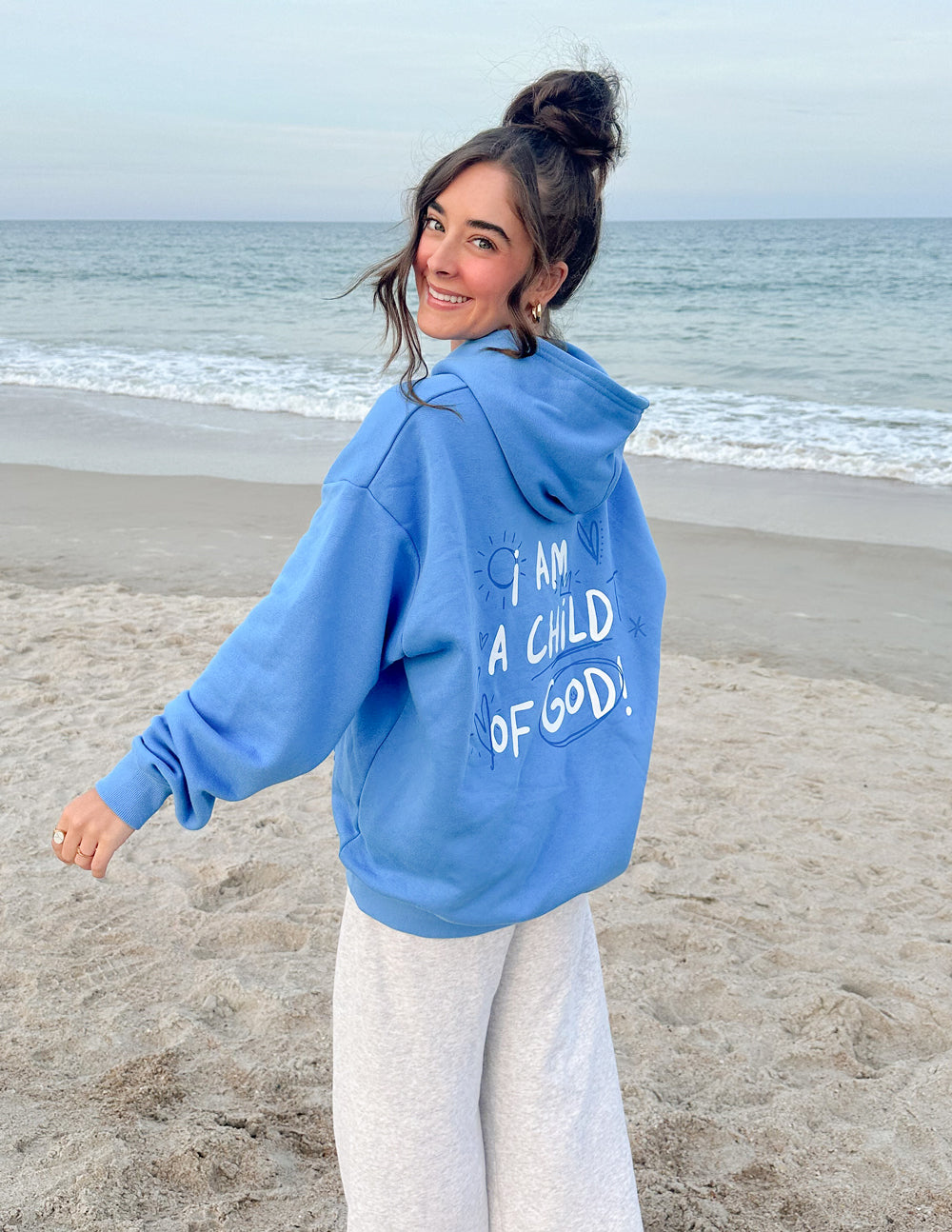 Light blue Christian Hoodie featuring the phrase I Am a Child of God on the back by Elevated Faith