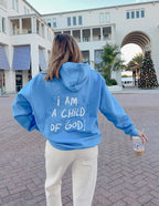 Light blue Christian Hoodie by Elevated Faith with the text I AM A CHILD OF GOD on the back
