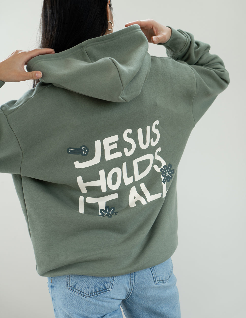 Elevated Faith Christian Hoodie in Olive Green with 'Jesus Holds It All' Design on Back