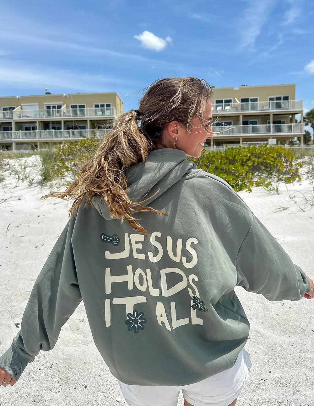 Elevated Faith Christian Hoodie in Green with 'Jesus Holds It All' Design for Comfortable Casual Wear