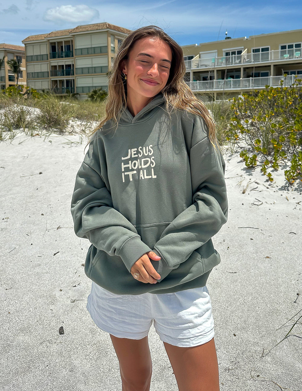 Elevated Faith Christian Hoodie in Olive Green with 'Jesus Holds It All' Design for Comfort and Style