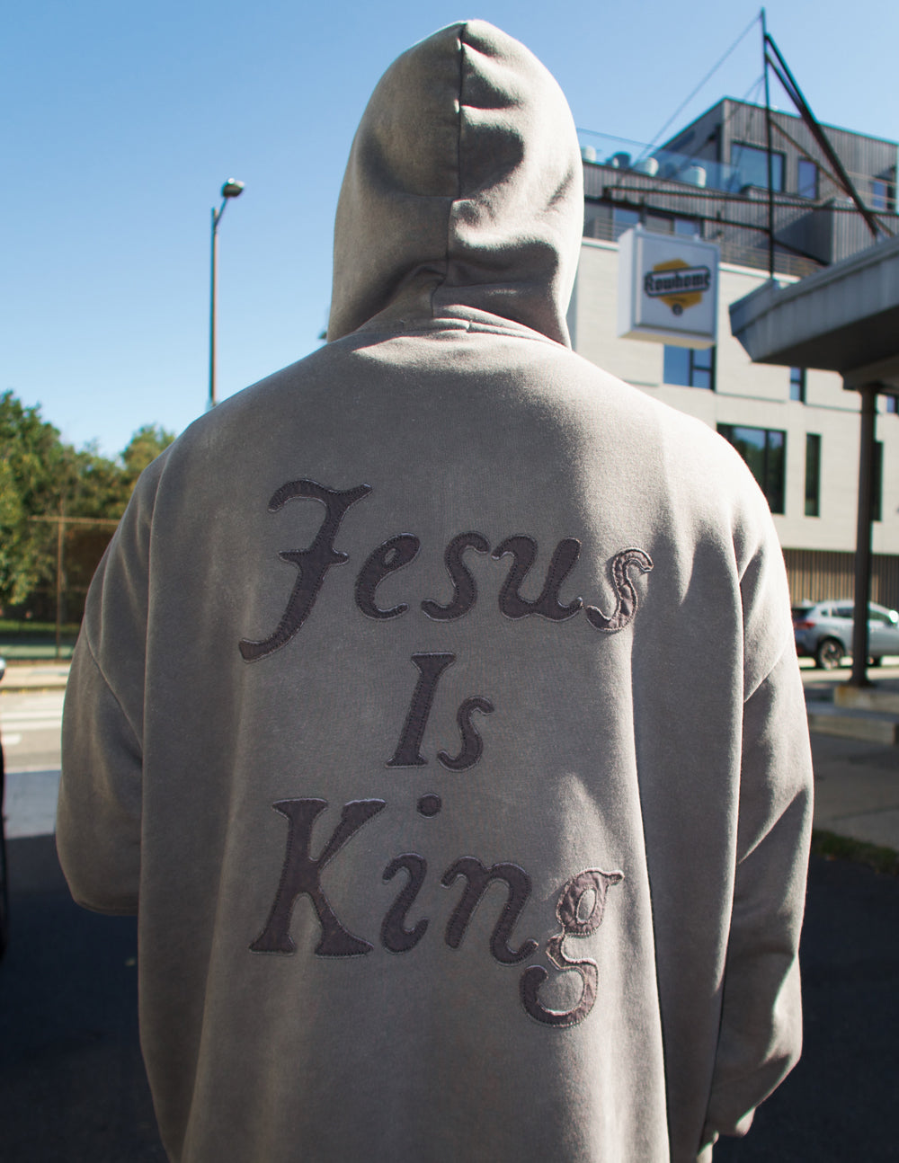 Elevated Faith Christian Hoodie featuring 'Jesus Is King' text on the back in stylish lettering